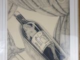 drawing of a bottle of wine in a gold frame on a wall