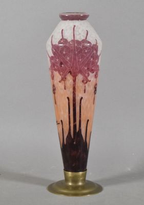 a glass vase with a pink flower inside of it