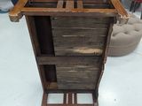 a wooden table with a drawer on top of it