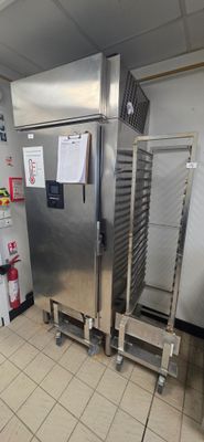 a commercial kitchen with stainless steel appliances and a refrigerator