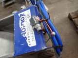 a blue cart with a baseball bat and a ball on it