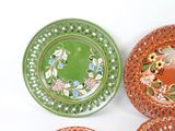 three plates that have different designs on them