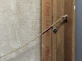a piece of wood that has been taped up to a wall