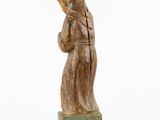 an old wooden statue of a woman holding a baby