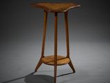 a small wooden table with a wooden top on a gray surface