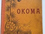 un vieux livre sur lequel est inscrit le titre « Okoma »