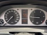 a close up of a car dashboard with a speedometer and gauges
