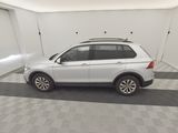 the white volkswagen suv is parked in the garage