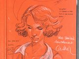 an orange book with a drawing of a woman ' s face and a speech bubble above her head