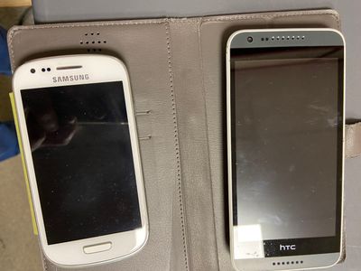 two cell phones that are sitting in a case