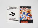 two nintendo games on the table next to each other