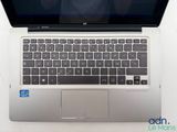 an open laptop computer sitting on top of a white table