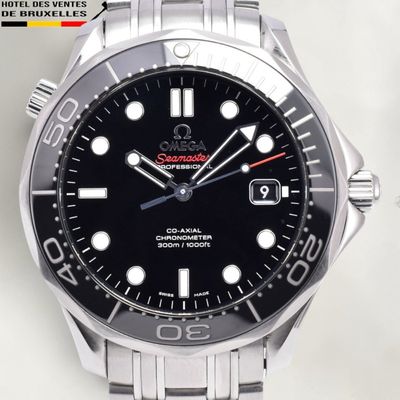 a close up of a watch on a white surface