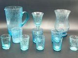 bottles and glasses are lined up in a row on a table