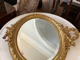 a table with a mirror on it in the middle of a room
