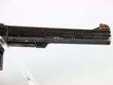 a gun that is on display on a table