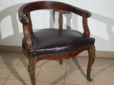 a chair that is sitting in a room with tile flooring