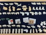 a picture of a shadow box with a lot of animals on it