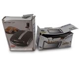packaging of a toaster and a box of food on a white surface