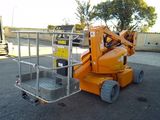 a picture of an orange scissor is parked in a parking lot