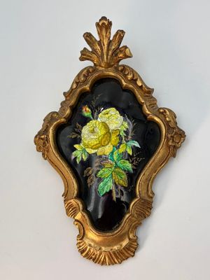 a picture of a picture of a rose in a gold frame