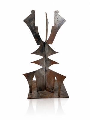 the sculpture is made of metal and has a geometric design