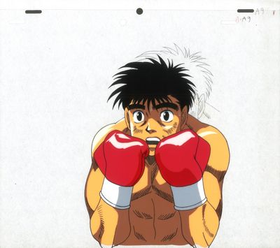 une photo d'un jeune homme portant des gants de boxe et prenant la pose