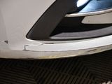 a close up of a car ' s front bumper with scratches on it