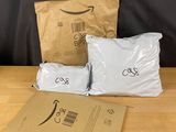 three bags of food sitting on top of a wooden table next to a brown bag