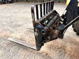 an image of a tractor with a skid steer attachment