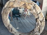 a mirror that is made out of drift wood
