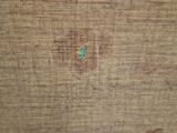 a close up of a piece of wood with a hole in it