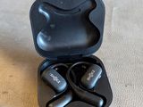 an image of a pair of black earphones sitting on top of a table