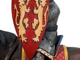 a statue of a man riding a horse with a shield on it