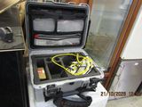 a suitcase with a bunch of wires inside of it