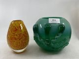 two vases sitting next to each other on a table