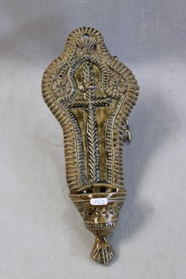 brass plated wall sconce with ornate design on a white background