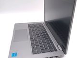a silver laptop with a blue sticker on the screen