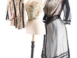 two dresses on a mannequin stand next to each other