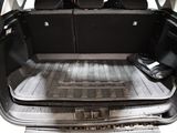 a trunk of a car with luggage in the back