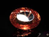 a large orange diamond sitting on top of a table