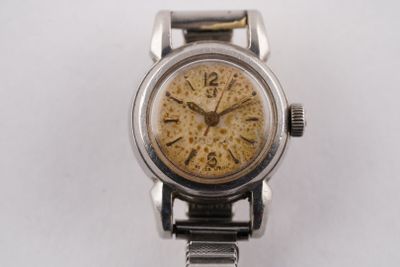 an image of a silver watch with a yellow face on a white surface