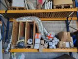 a shelf full of assorted items in a garage