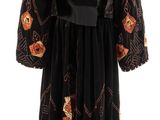 an image of a black dress with orange flowers on it