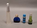 a bottle of perfume next to a bottle of perfume and a bottle of perfume