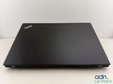 a close up of a laptop on a table with a white background