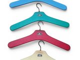 a set of five wooden hangers with different colors of hangers