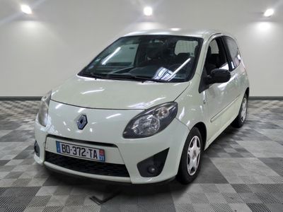 a picture of a small white car parked in a garage
