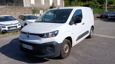 a white van that is parked on the side of the road