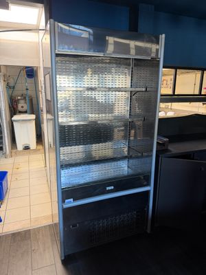 an image of a commercial refrigerator in a kitchen